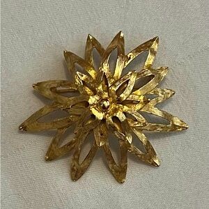 Vintage MONET gold tone sunburst brooch